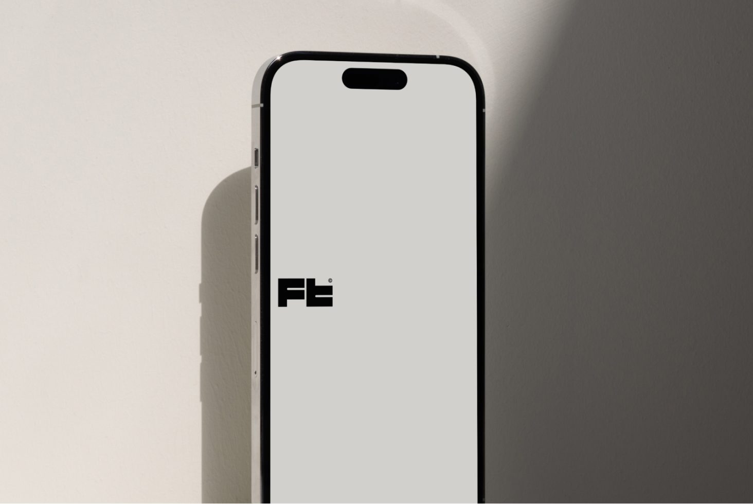 Smartphone mockup with shadow on neutral background for app design presentation, showcases sleek mobile device frame with blank screen for graphic display.